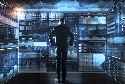 Important,Statistics.,Calm,Clever,Thoughtful,Programmer,Putting,His,Hands,On A businessman analyzing data on a digital interface