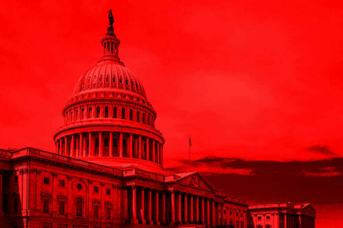 shutterstock_1142146865 United States Capitol building under red-tinted sky.