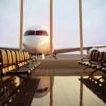 Back-To-Gate Shock: TSA Changes Rules Airplane viewed from an empty airport waiting area.