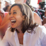 Kamala Harris smiling in a crowd