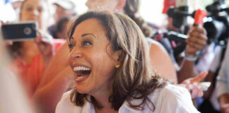 Kamala Harris smiling in a crowd