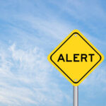 Toxic Food Pulled – Multiple States on Alert Yellow alert sign against a blue sky