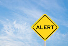 Toxic Food Pulled – Multiple States on Alert Yellow alert sign against a blue sky