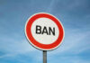 Sign reading BAN against blue sky background