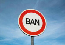TSA Chair Ban Sparks Airport Uproar Sign reading BAN against blue sky background