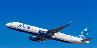 JetBlue Airbus A321 climbing against a clear blue sky
