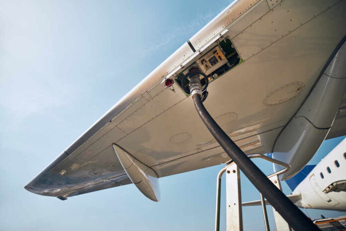 Ground,Service,Before,Flight.,Refueling,Of,Airplane,At,Airport. Fueling an airplane at the airport