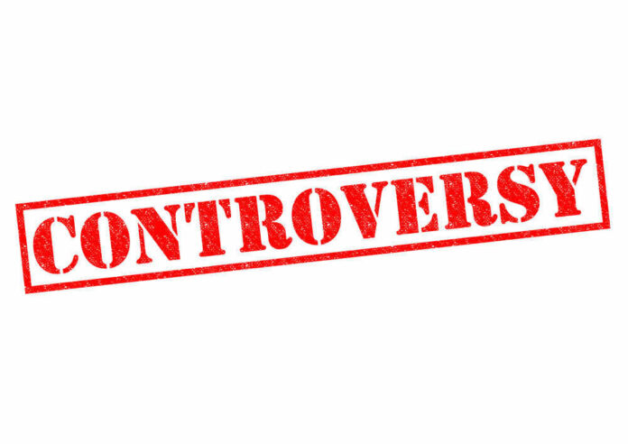 shutterstock_186387446 Controversy stamp in bold red letters