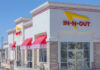 Burger Purists Learn Of Changes at In-N-Out In-N-Out Burger sign with yellow arrow in city setting