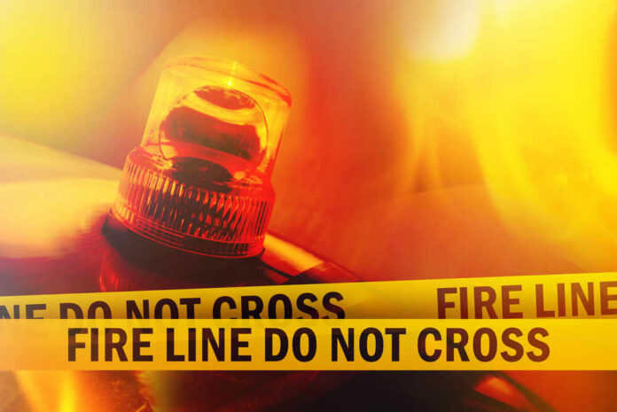 Fire,Line,Do,Not,Cross,Yellow,Headband,Tape,And,Orange Firefighter emergency light with fire line tape