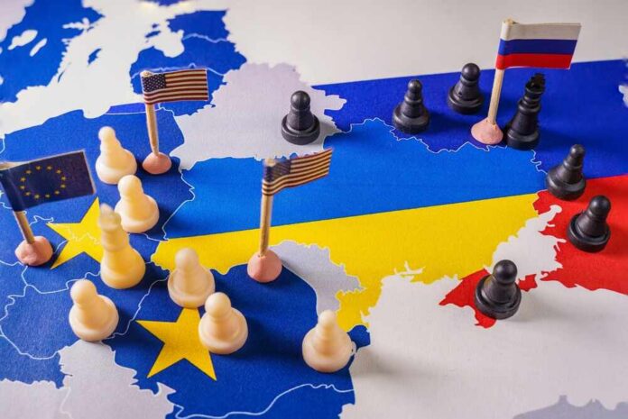 shutterstock_2118165380 A map of Europe with chess pieces and flags representing different countries