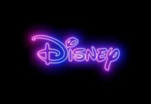Neon Disney logo glowing against a dark background