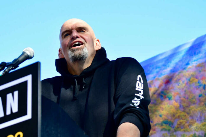shutterstock_2213690401 John Fetterman speaking at podium.