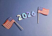 Deep-Red State STUNNER? Two small American flags next to the numbers 2026 on a blue background