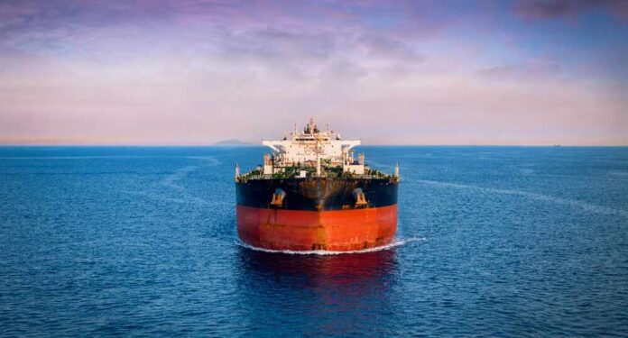 Aerial,Front,View,Of,A,Heavy,Crude,Oil,Tanker,Traveling Oil tanker ship on open sea at dusk