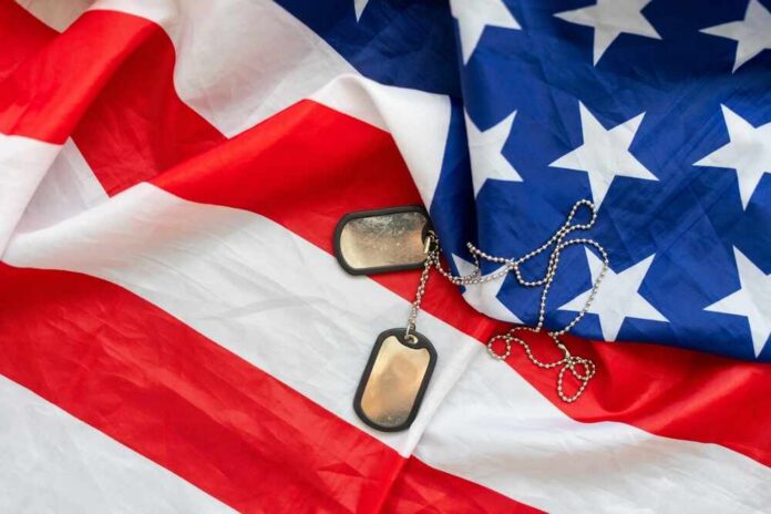 Military,Dog,Tags,On,American,Flag,With,Embroidered,Stars Dog tags on an American flag