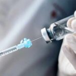Unapproved Weight Shots Flood Clinics A healthcare professional preparing a syringe from a vial