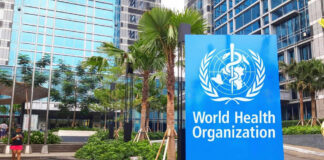 World Health Organization sign outside modern building