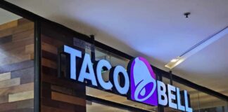 Taco Bell storefront sign with illuminated logo
