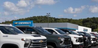 Row of pickup trucks at a dealership lot