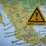 Tainted Products Pulled From Amazon, Walmart A close-up of a map of Mexico with a yellow warning sign placed on it