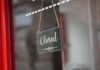 A closed sign hanging on a shop window