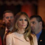 Melania’s Warning Stuns Americans Melania Trump at an event with a crowd in the background