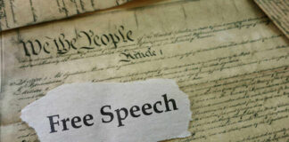 U.S. Constitution with Free Speech text overlay.