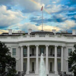 White House with a rainbow in the sky.