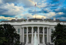 Five-Day Fiasco Rocks White House White House with a rainbow in the sky.