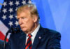 VIDEO: Trump Rally Turns Brutal Donald Trump speaks at a podium.
