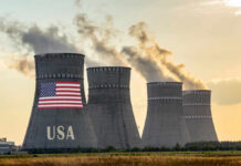 Fire Erupts Inside Nuclear Complex Cooling towers with USA flag and smoke clouds