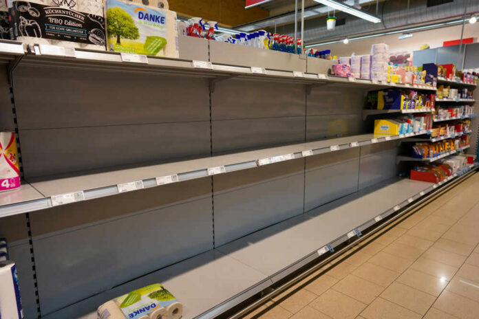 shutterstock_1663611619 Empty supermarket shelves with sparse products displayed