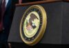 DOJ Curveball Backfires Department of Justice seal on a podium.
