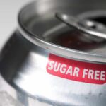 Close-up of a soda can with a 'sugar free' label