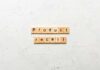 Walgreens Eye Drops Pulled Over Sterility Scare Wooden letter tiles forming words on a white textured surface