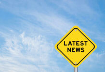 Mega Merger Looms – Fees Next? Yellow sign with text Latest News on sky background