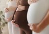 CDC ALARM: Baby Bust Deepens Pregnant women standing side by side holding their bellies