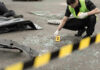 Birthday Tragedy: Mystery Death Stuns Fans Police investigating crime scene with evidence marker and body bag.